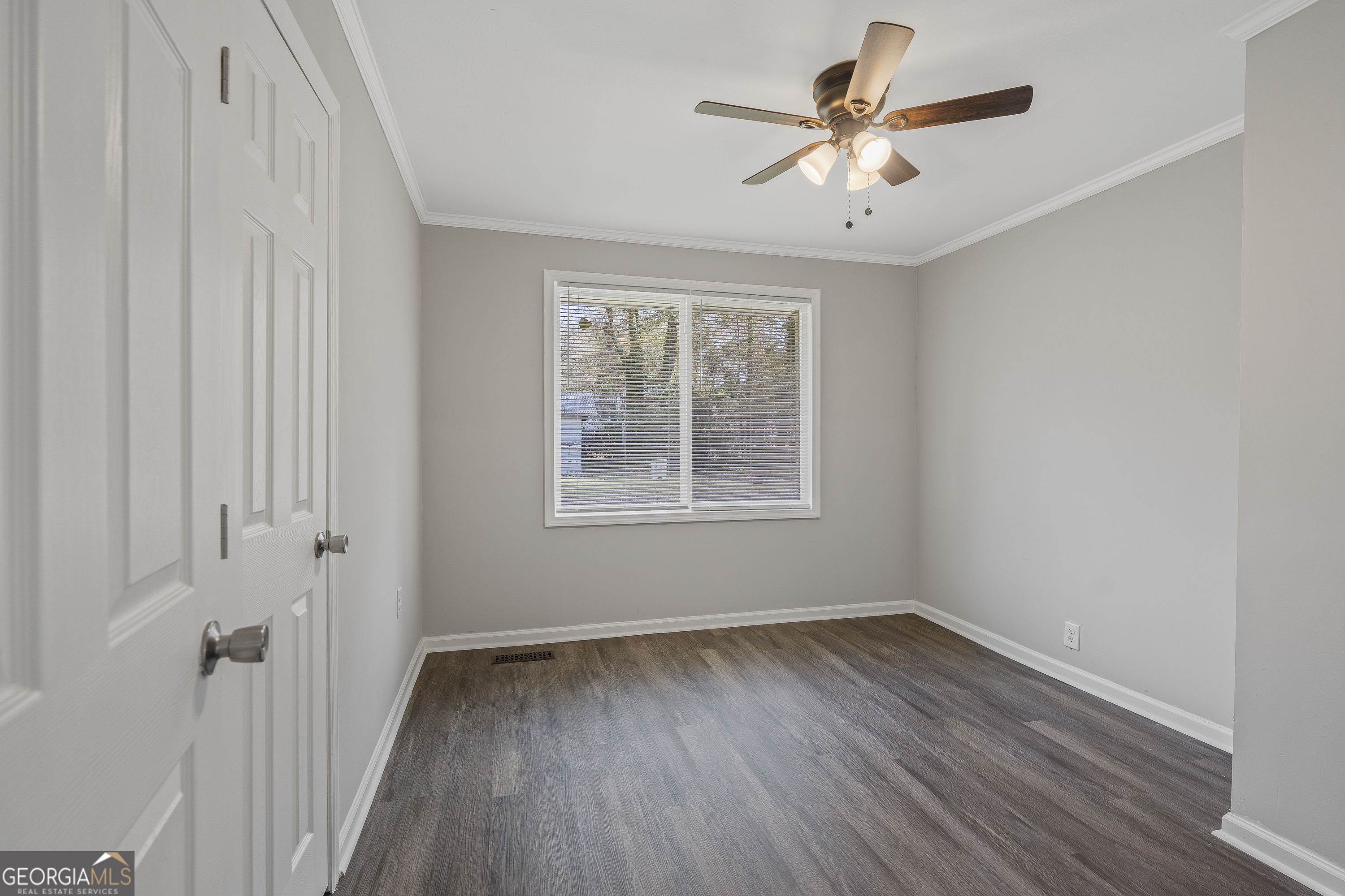 4622 Wilson Road Macon, GA 31206 - Photo 13 of 24 a view of empty room with wooden floor and fan