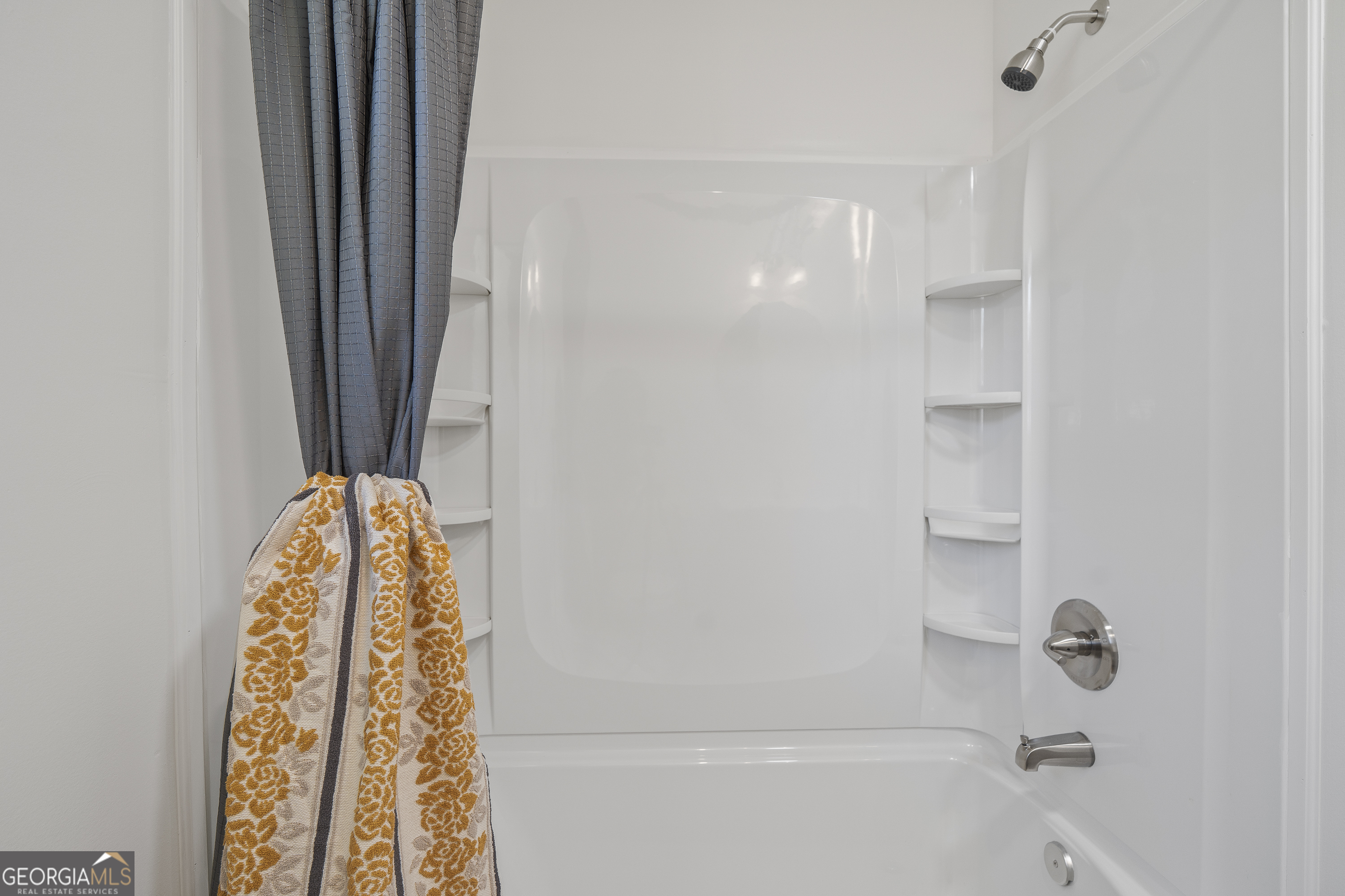 4622 Wilson Road Macon, GA 31206 - Photo 16 of 24 a bathroom with a window and a shower