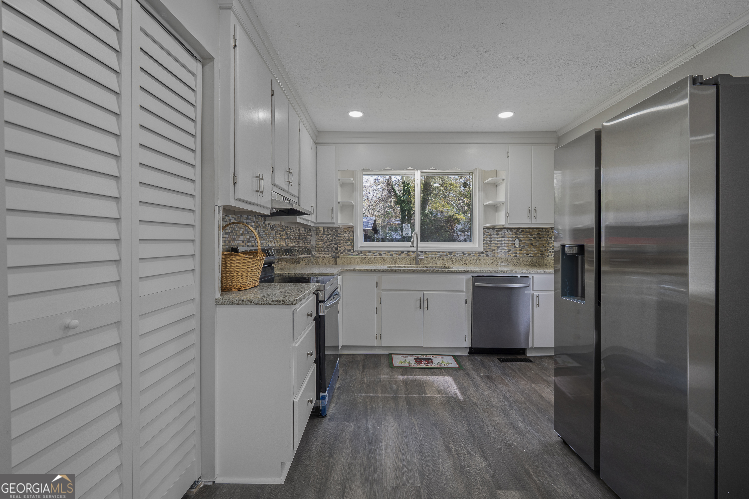 4622 Wilson Road Macon, GA 31206 - Photo 9 of 24 a kitchen with a sink stainless steel appliances and cabinets