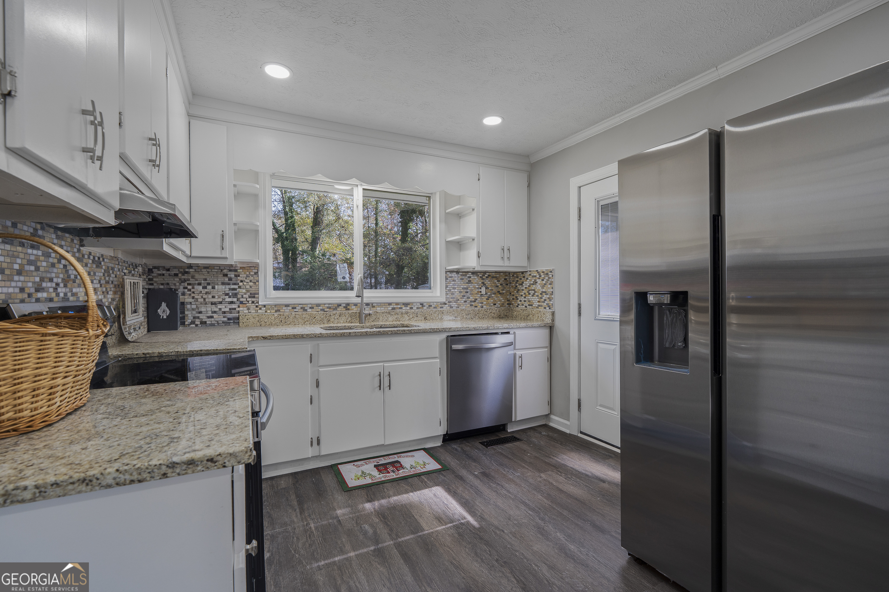 4622 Wilson Road Macon, GA 31206 - Photo 10 of 24 a kitchen with a sink stove and refrigerator
