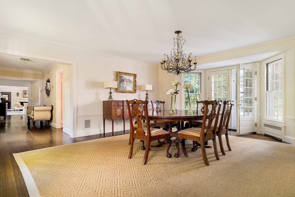 200 Cliff Road Wellesley, MA 02481 - Photo 11 of 41 a view of a dining room with furniture and chandelier