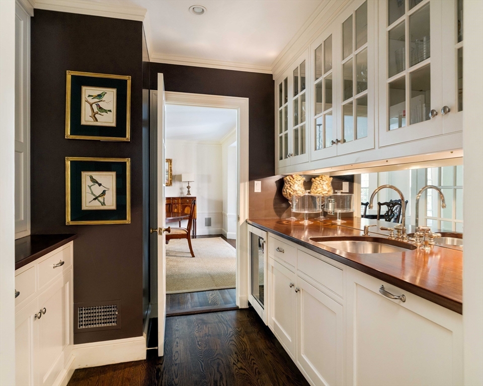 200 Cliff Road Wellesley, MA 02481 - Photo 14 of 41 a kitchen with stainless steel appliances granite countertop a stove and cabinets