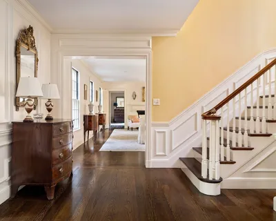 a large kitchen with stainless steel appliances granite countertop a sink a stove and a refrigerator