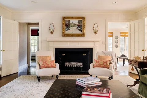 a spacious bedroom with a bed and large windows