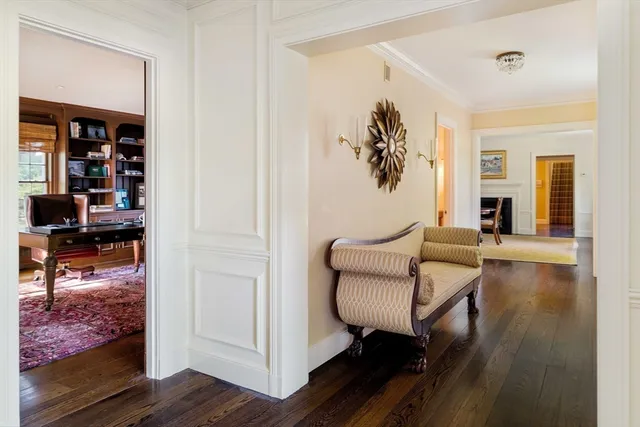 a bedroom with two beds and large window