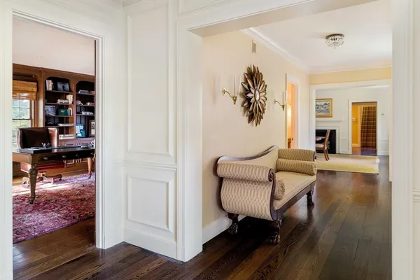 a spacious bedroom with a bed and large windows