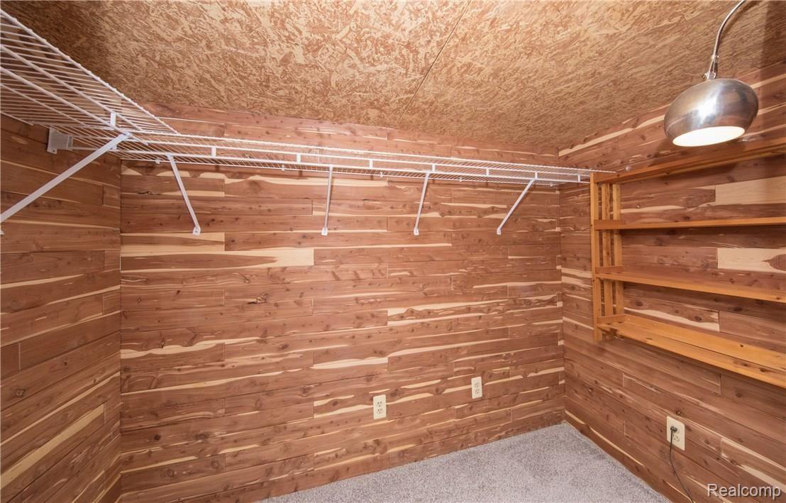8980 Sashabaw Road Clarkston, MI 48348 - Photo 28 of 32 Handy Cedar Lined Closet in Lower Level for all types of items to be stored