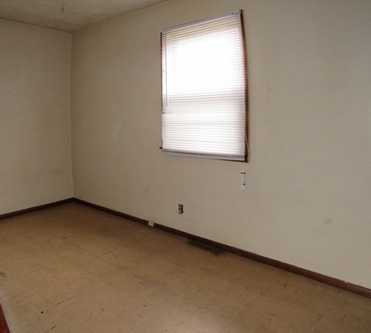 1507 Hedge Road Champaign, IL 61821 - Photo 8 of 8 an empty room with a window