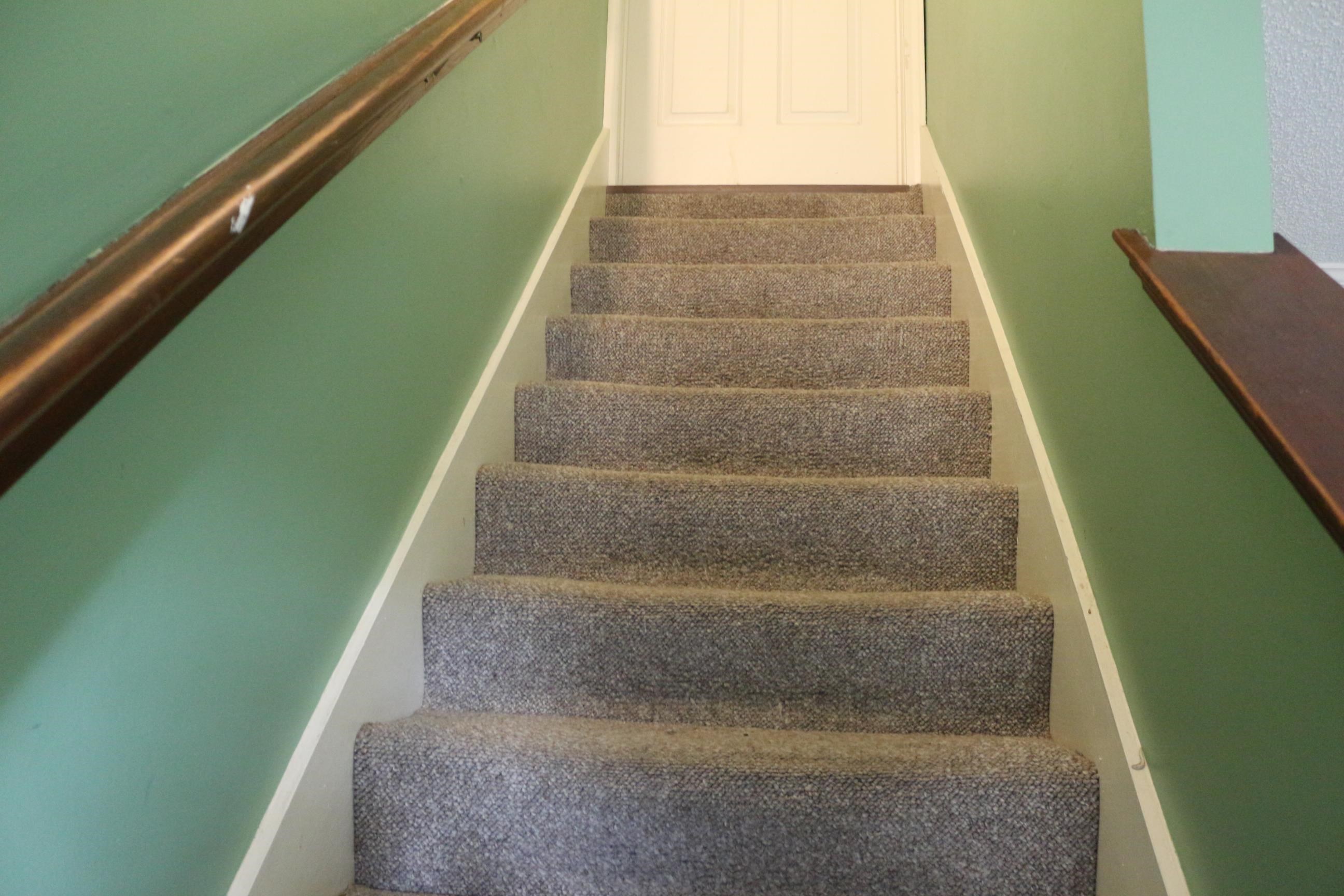 4204 Hickory Grove Road Memphis, TN 38141 - Photo 11 of 15 a view of staircase with white walls and a window