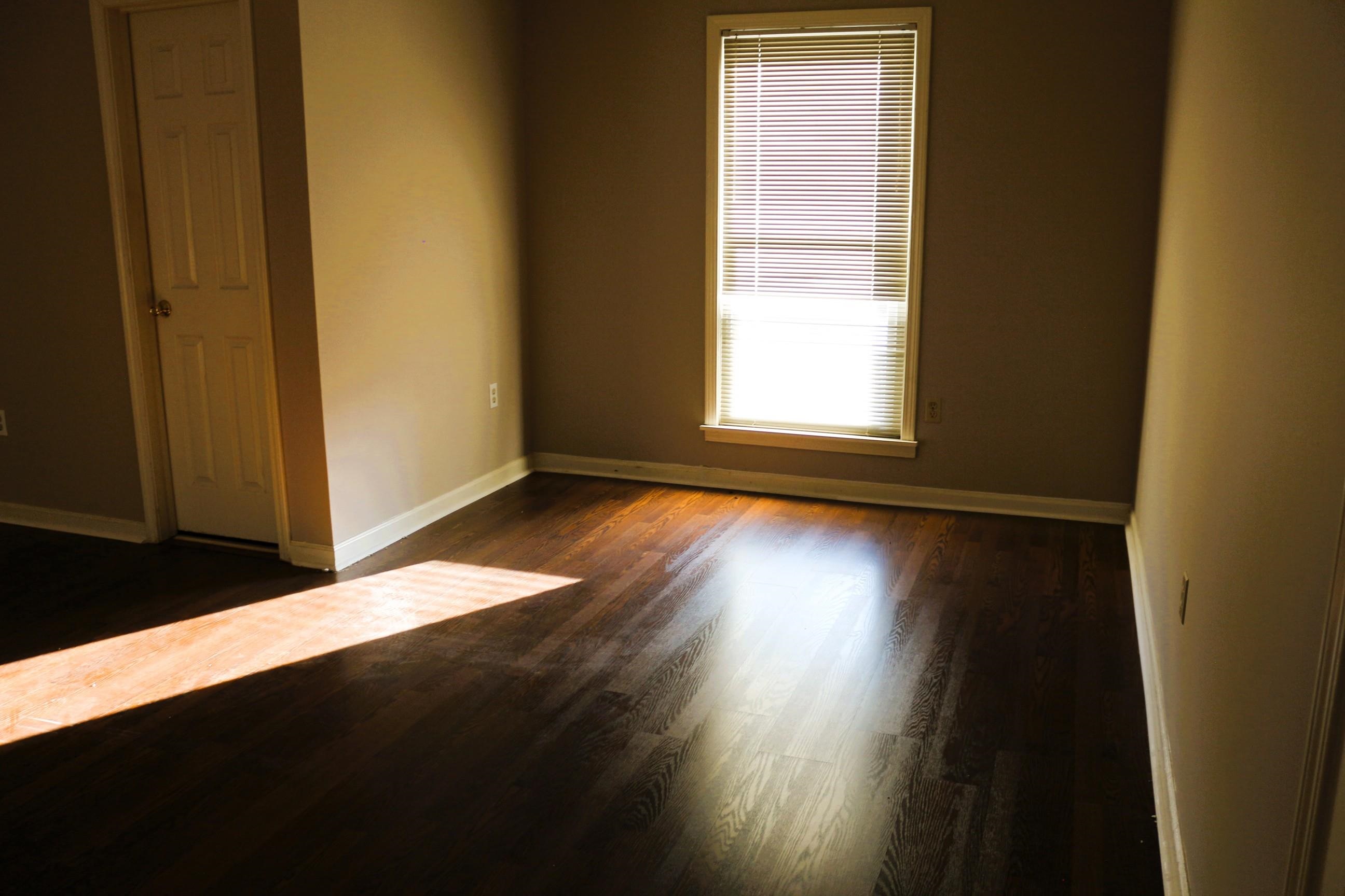 4204 Hickory Grove Road Memphis, TN 38141 - Photo 14 of 15 a view of a room has wooden floor and a window