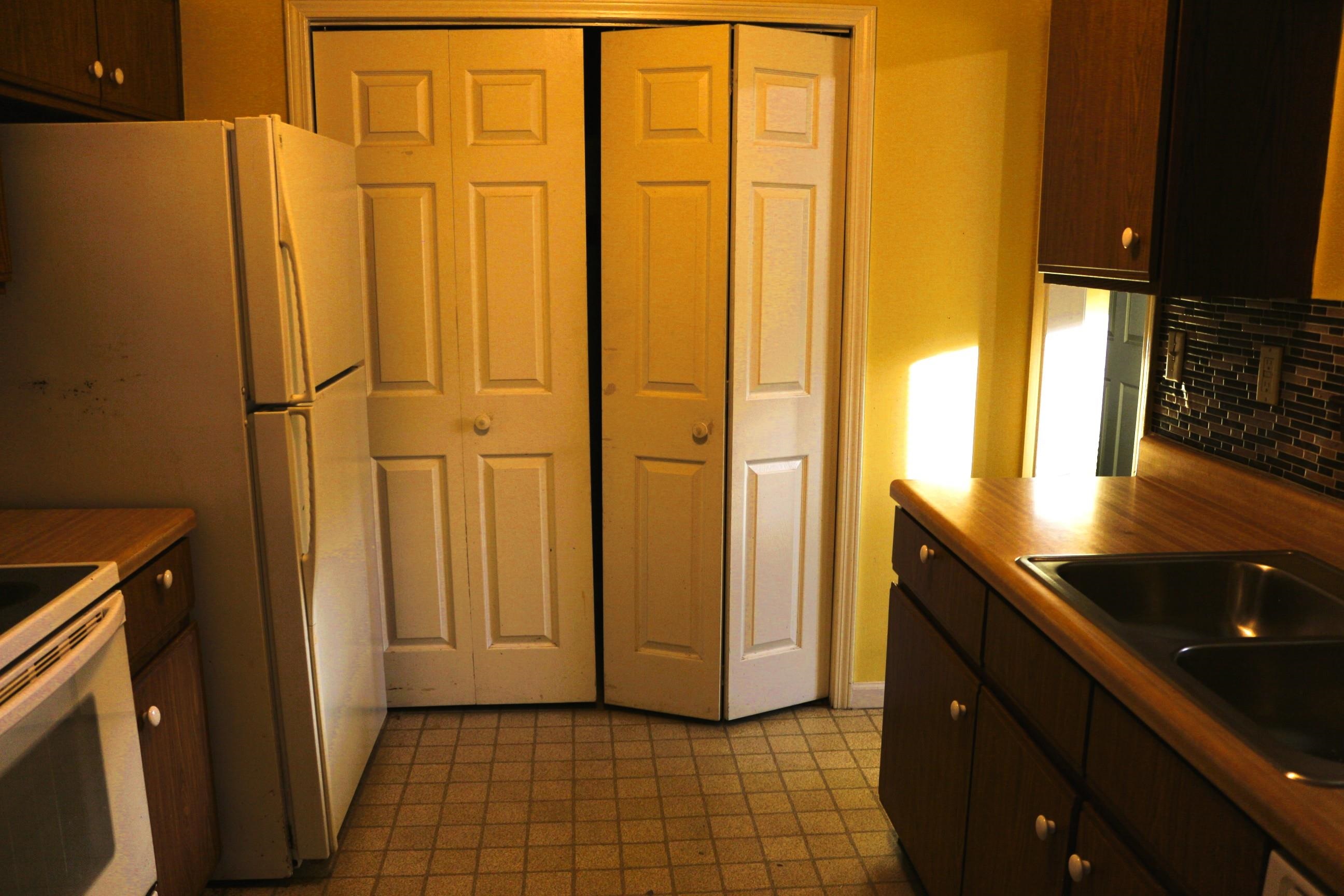 4204 Hickory Grove Road Memphis, TN 38141 - Photo 4 of 15 a view of a refrigerator and window in a kitchen