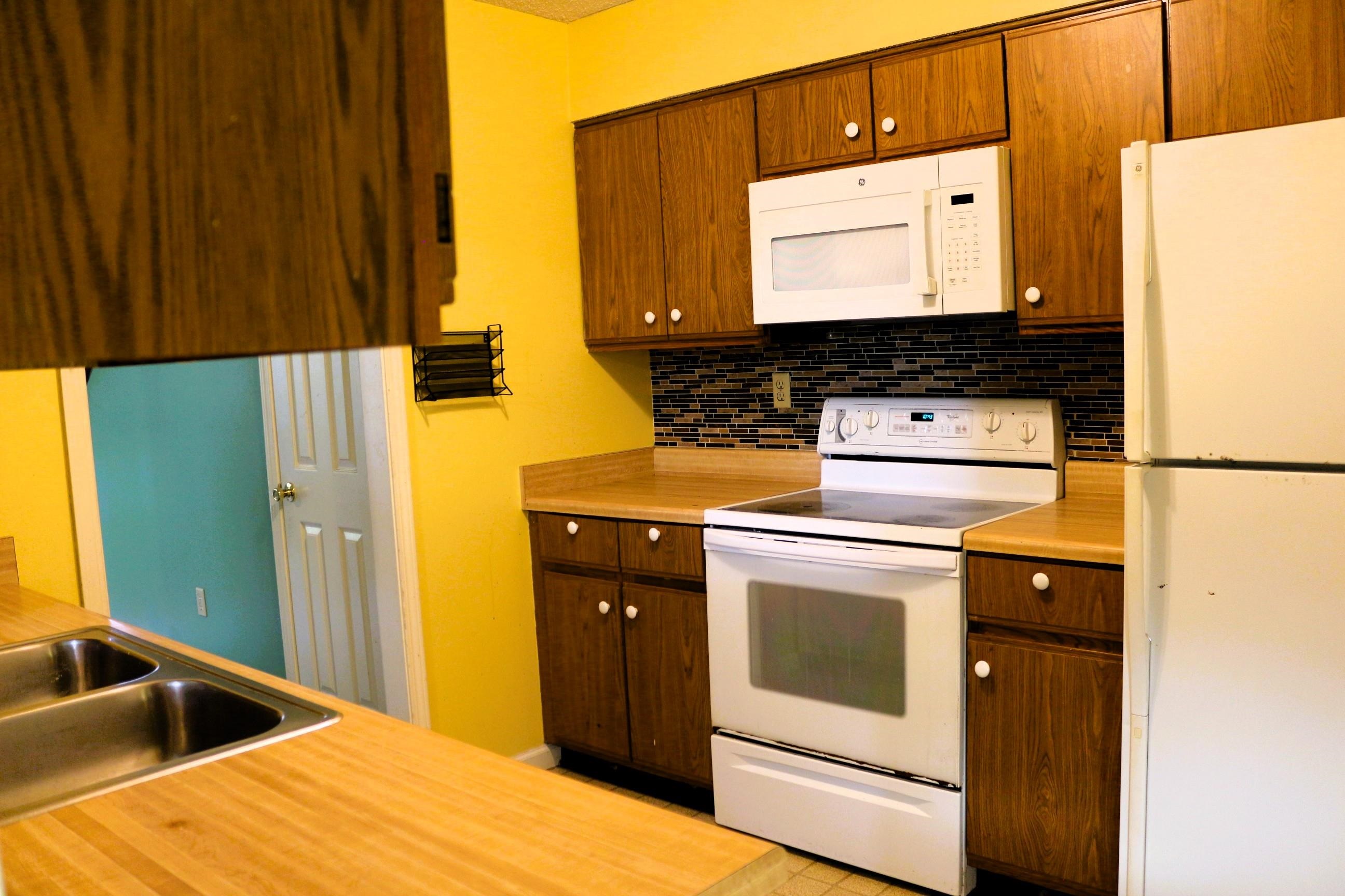 4204 Hickory Grove Road Memphis, TN 38141 - Photo 6 of 15 a kitchen with a stove top oven