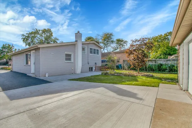 a view of backyard with green space