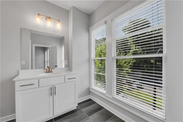 a bathroom with a sink toilet tub and shower