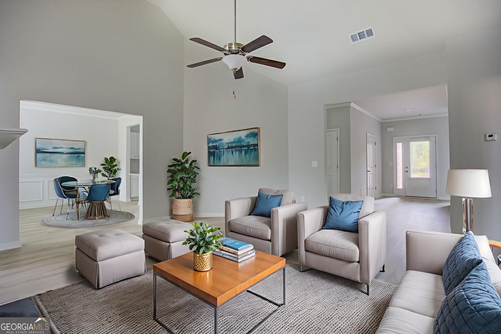 1007 Towne Circle Social Circle, GA 30025 - Photo 13 of 48 a living room with furniture a rug and a lamp