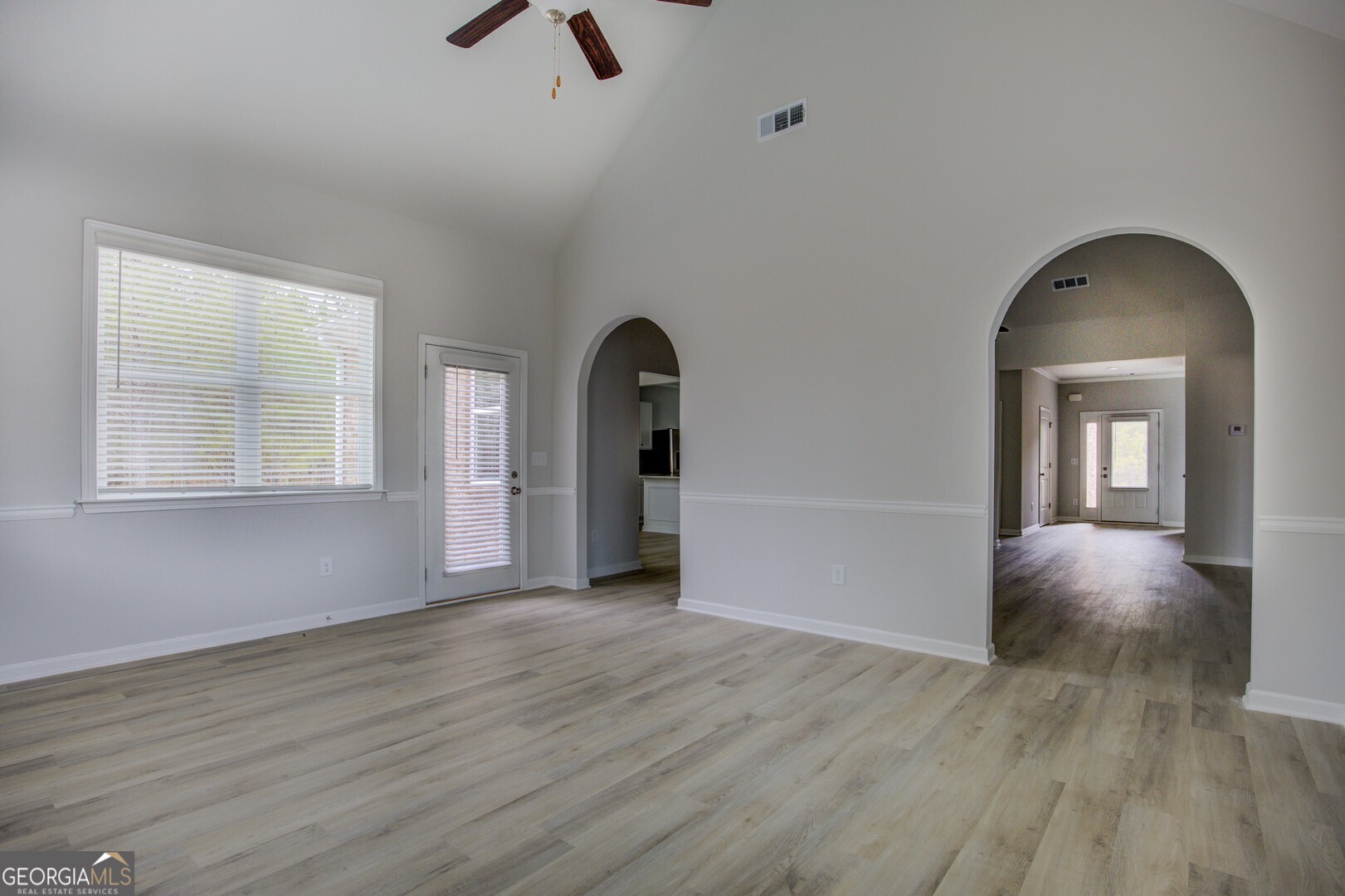 1007 Towne Circle Social Circle, GA 30025 - Photo 18 of 48 wooden floor in an empty room with a window