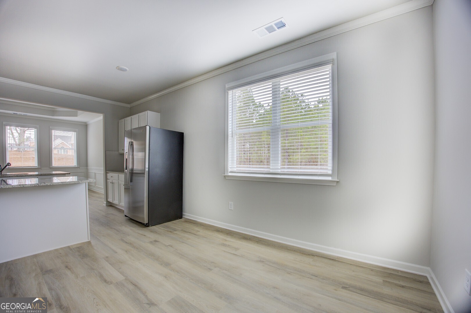 1007 Towne Circle Social Circle, GA 30025 - Photo 30 of 48 a view of a kitchen with a refrigerator cabinet and a window