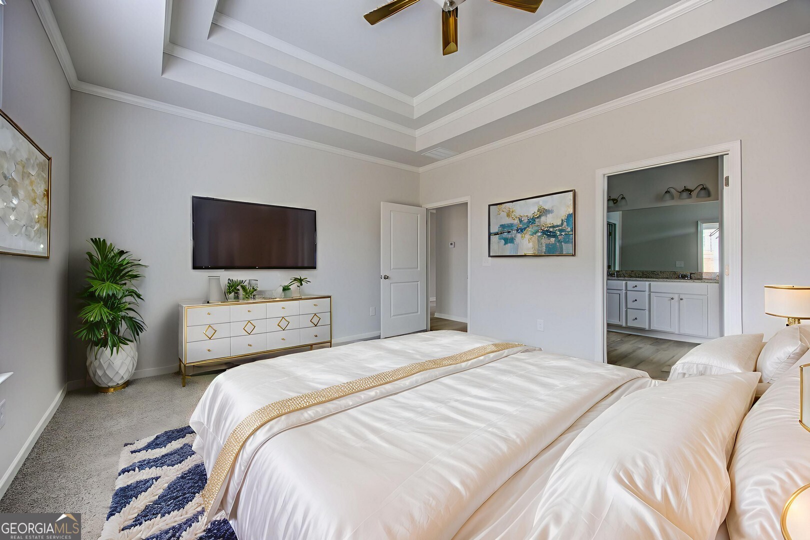 1007 Towne Circle Social Circle, GA 30025 - Photo 35 of 48 a bedroom with a bed and a flat screen tv