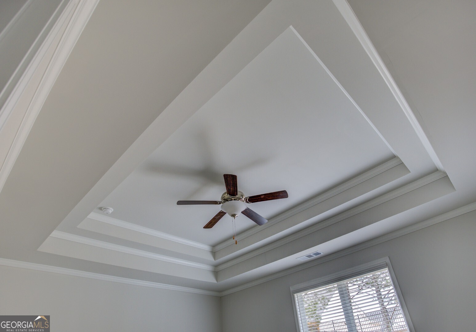 1007 Towne Circle Social Circle, GA 30025 - Photo 36 of 48 a hallway with a ceiling fan