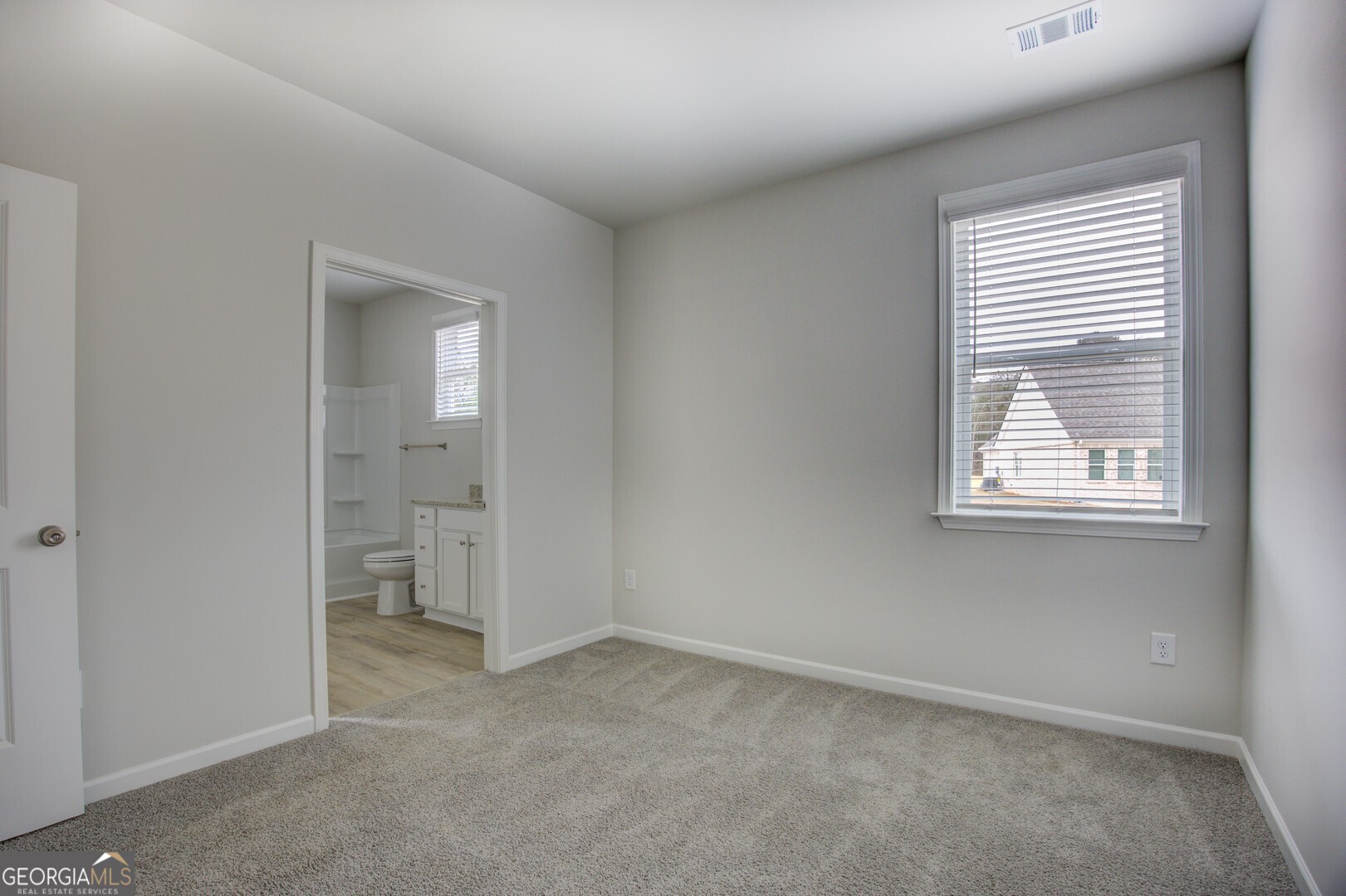 1007 Towne Circle Social Circle, GA 30025 - Photo 42 of 48 an empty room with windows and closet