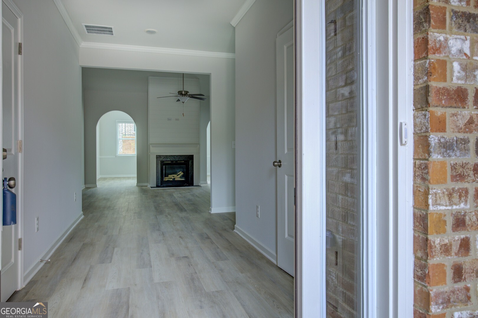 1007 Towne Circle Social Circle, GA 30025 - Photo 9 of 48 a view of a livingroom with a fireplace window and wooden floor