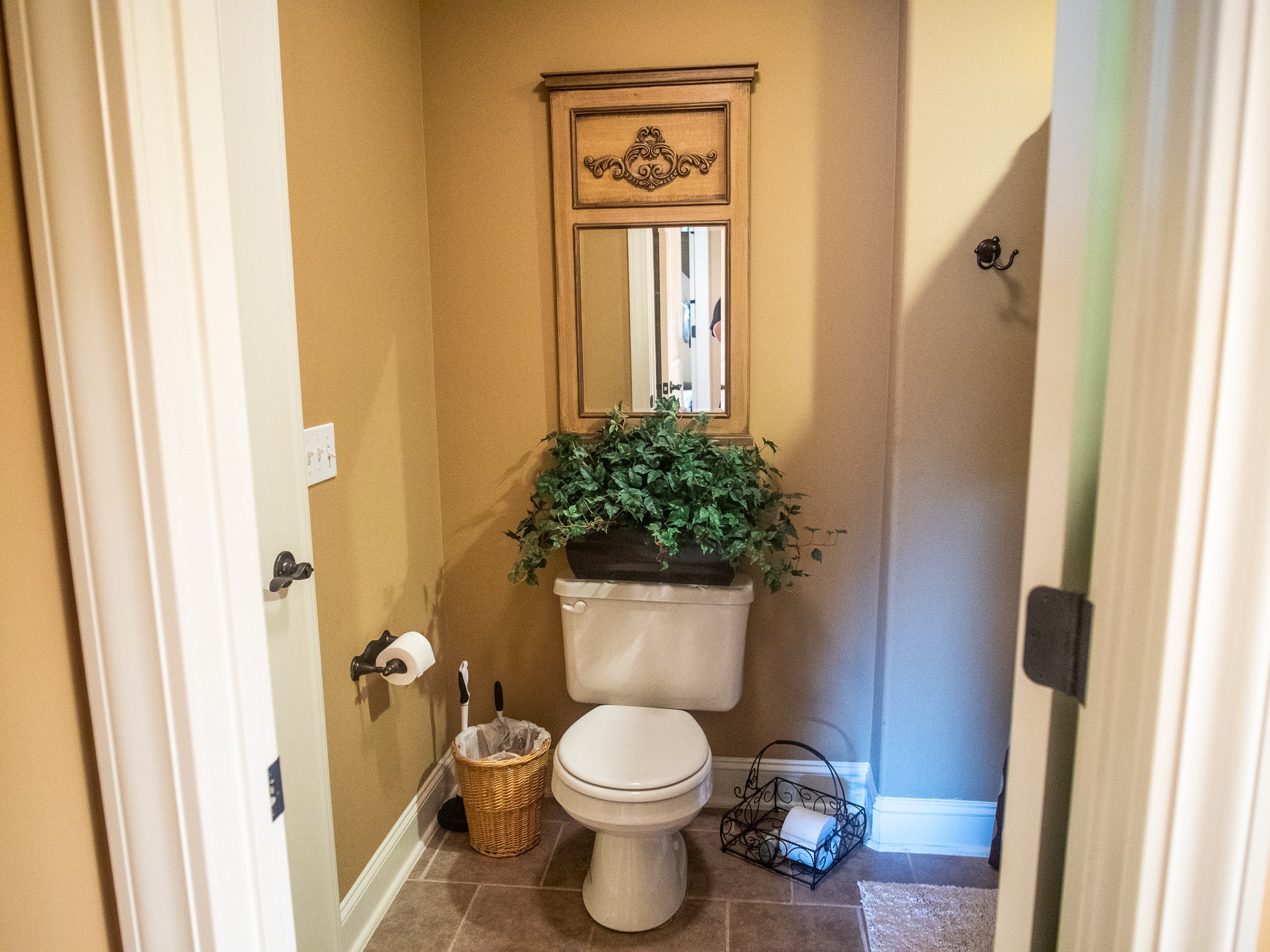 4205 Franklin Road Lebanon, TN 37090 - Photo 25 of 39 a white toilet sitting next to a bathroom sink and a window