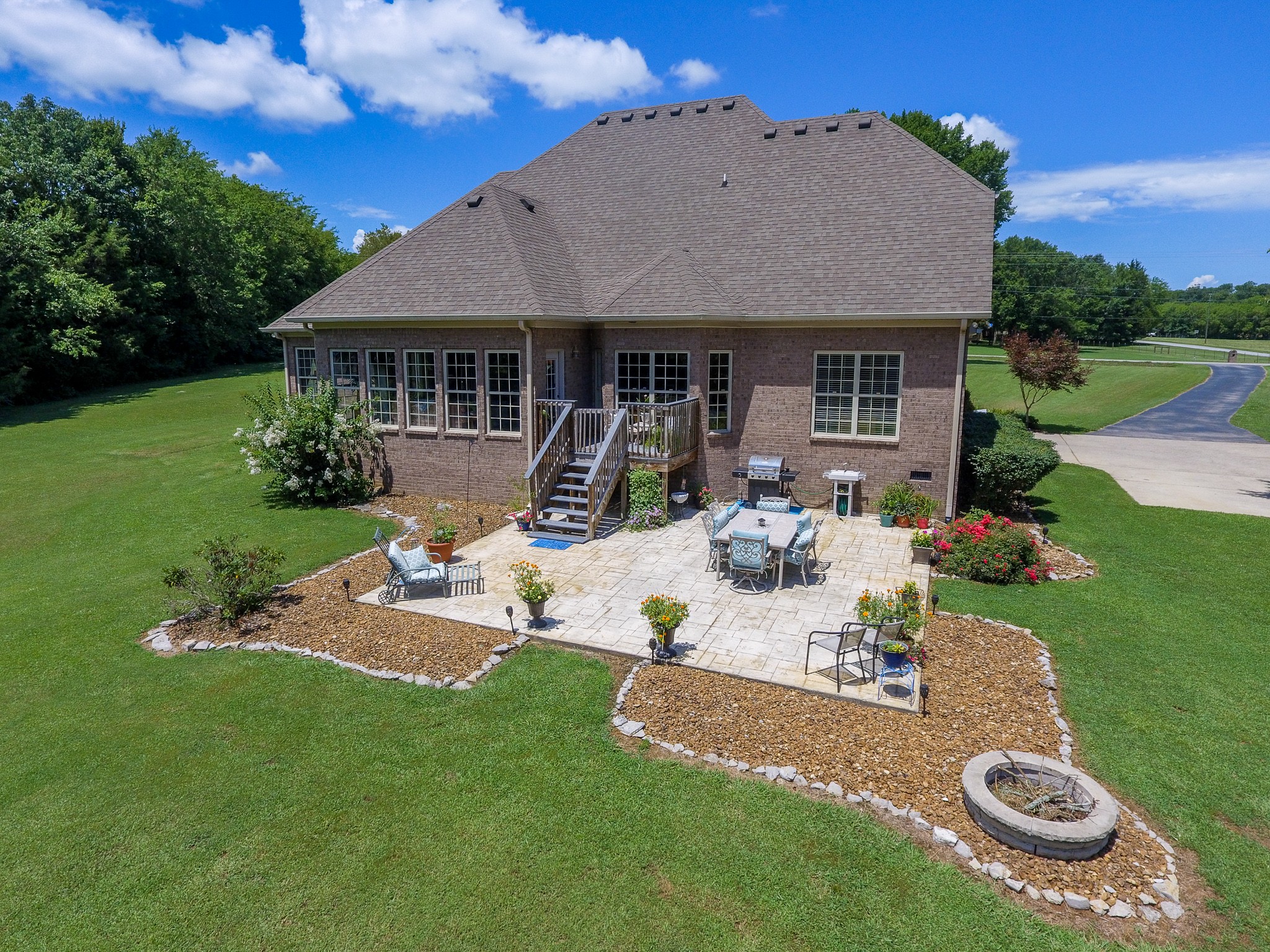 4205 Franklin Road Lebanon, TN 37090 - Photo 32 of 39 a view of a house with backyard sitting area and garden