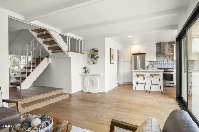 a view of kitchen with furniture and wooden floor