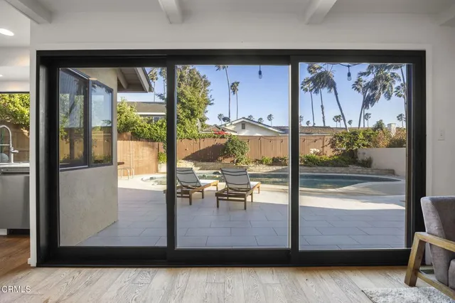 a view of water heater room with wooden floor