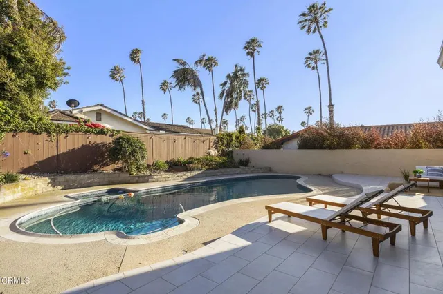 a view of a backyard with a tub