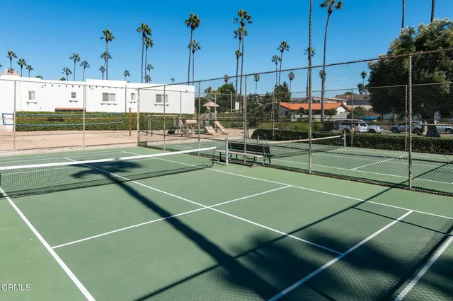 a view of a patio with a table and chairs