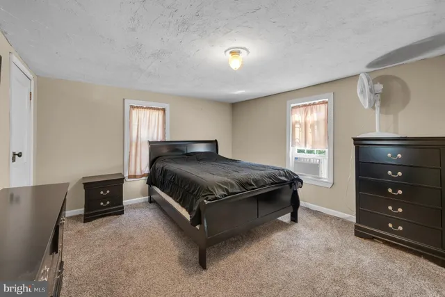 a bedroom with a bed and a closet