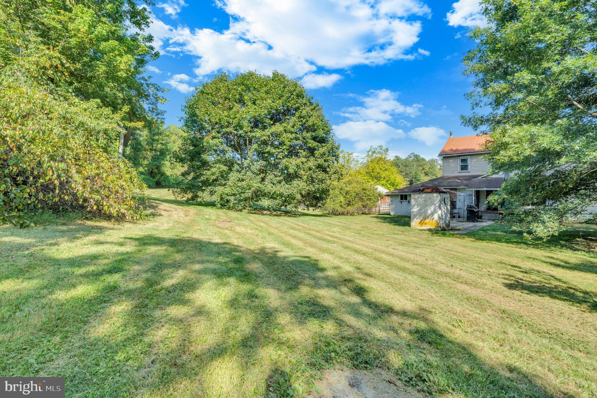 200 Creek Road Gardners, PA 17324 - Photo 22 of 25 a view of a big yard with plants and large trees