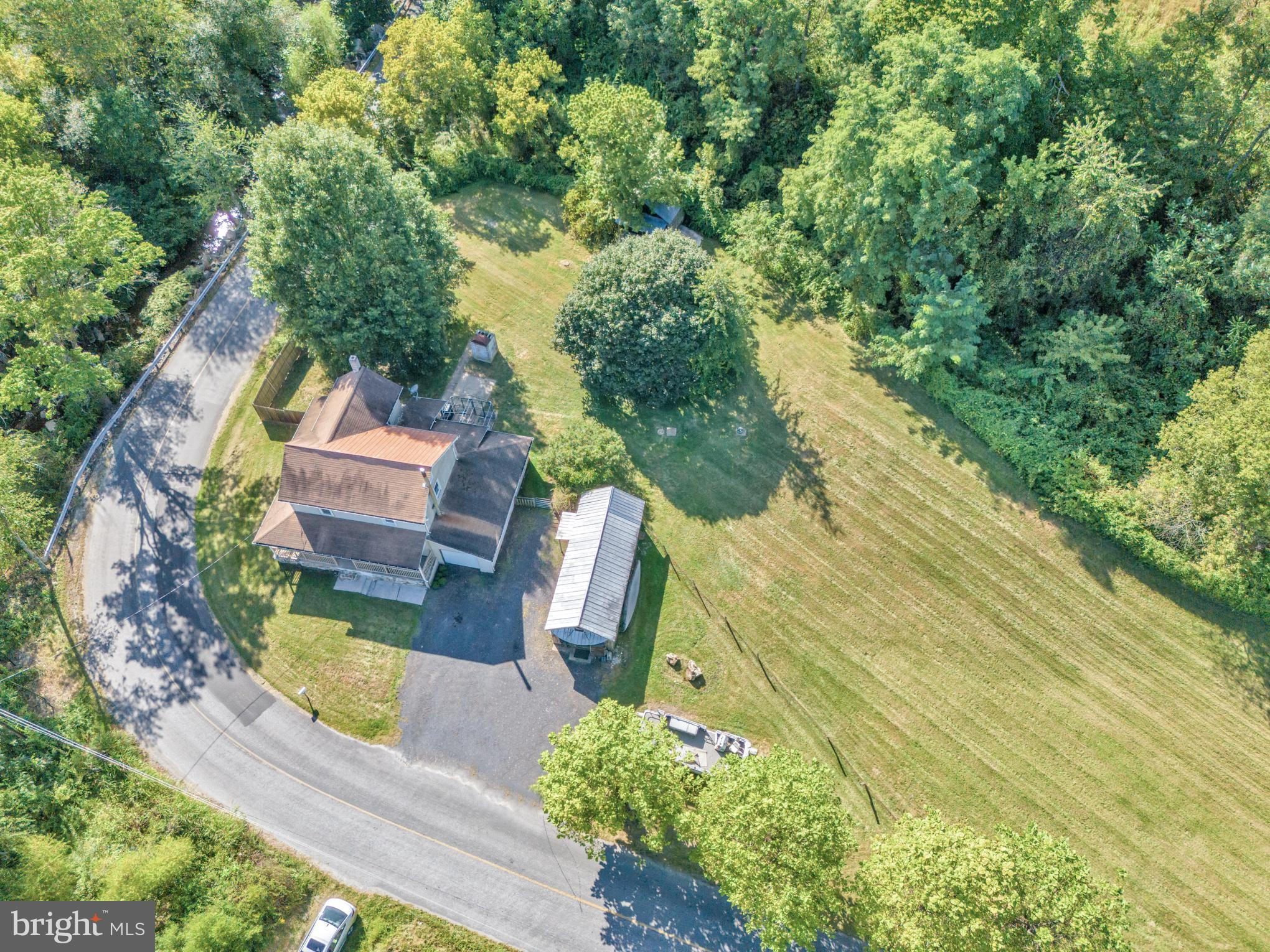 200 Creek Road Gardners, PA 17324 - Photo 3 of 25 an aerial view of a house with swimming pool and garden