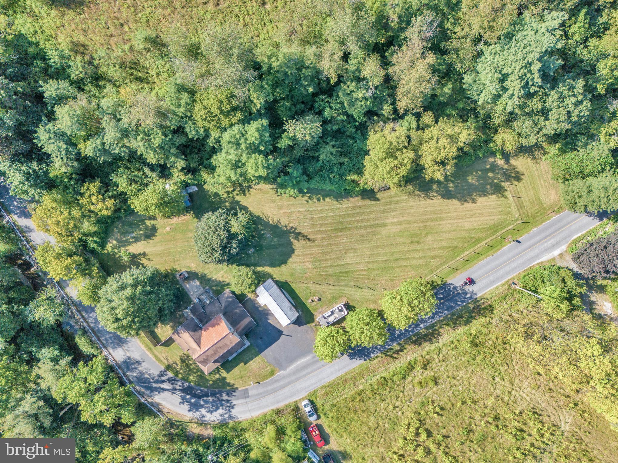 200 Creek Road Gardners, PA 17324 - Photo 4 of 25 a view of a lake with a yard