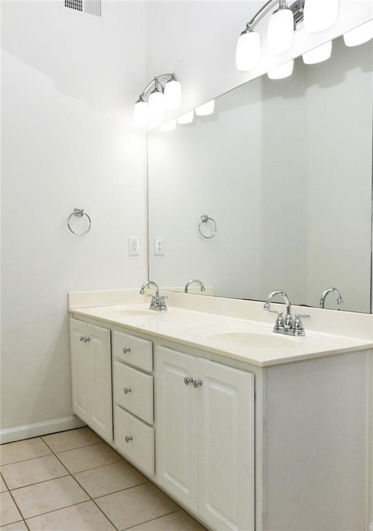 795 Sunset Ridge Lane Southeast Lawrenceville, GA 30045 - Photo 18 of 57 a bathroom with a sink vanity and a mirror