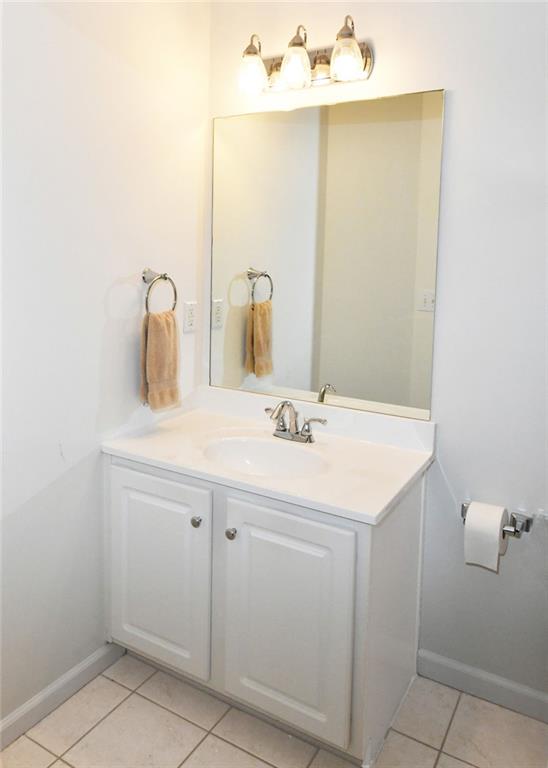 795 Sunset Ridge Lane Southeast Lawrenceville, GA 30045 - Photo 23 of 57 a bathroom with a sink and a mirror