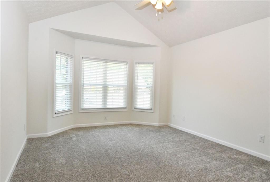 795 Sunset Ridge Lane Southeast Lawrenceville, GA 30045 - Photo 26 of 57 an empty room with a empty space and a window