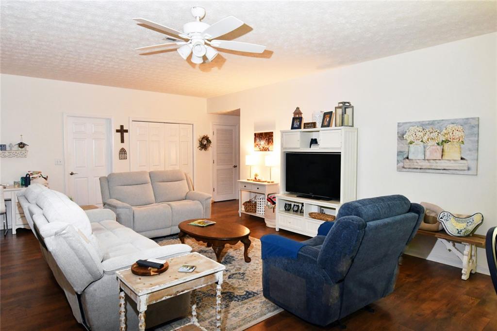 795 Sunset Ridge Lane Southeast Lawrenceville, GA 30045 - Photo 37 of 57 a living room with furniture and a flat screen tv