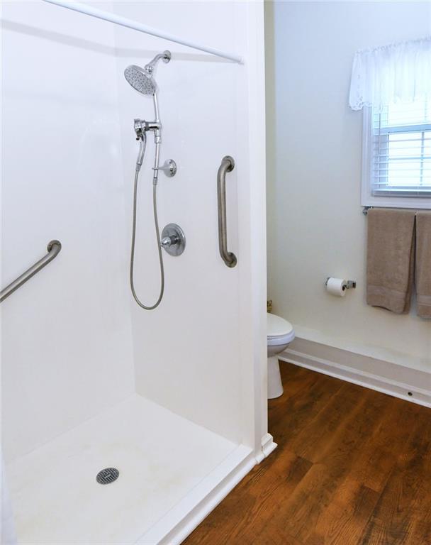 795 Sunset Ridge Lane Southeast Lawrenceville, GA 30045 - Photo 45 of 57 a bathroom with a bath tub with a shower