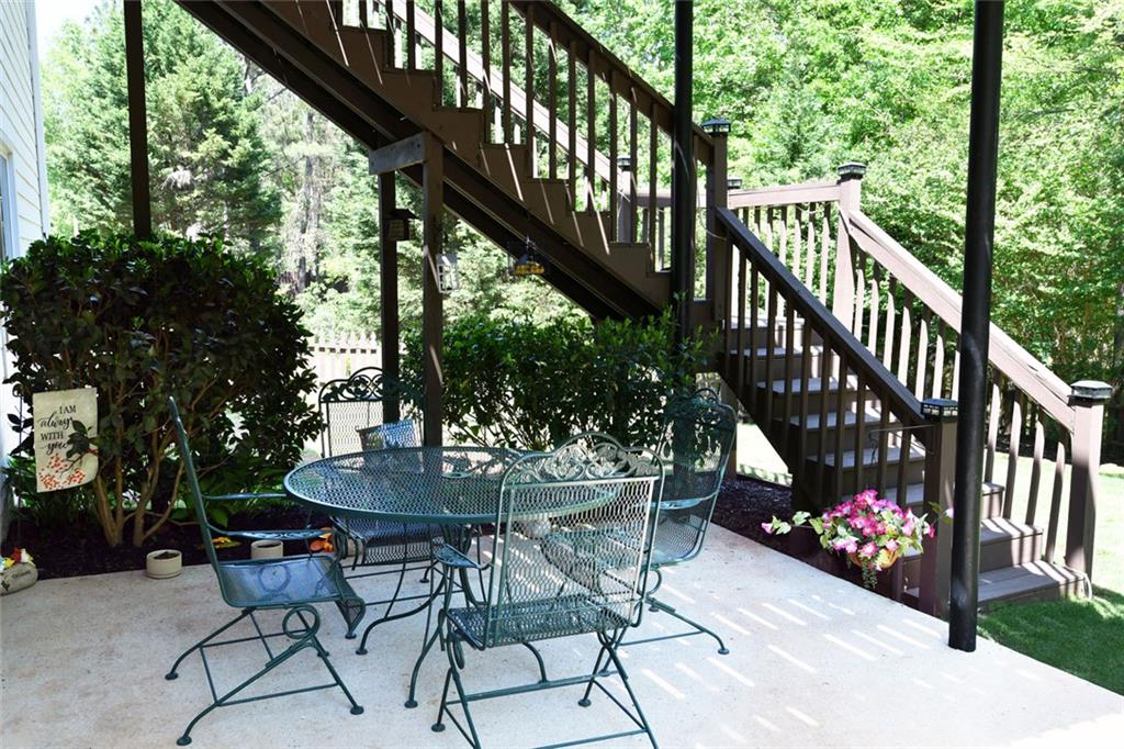 795 Sunset Ridge Lane Southeast Lawrenceville, GA 30045 - Photo 49 of 57 a view of a chairs and table in the balcony