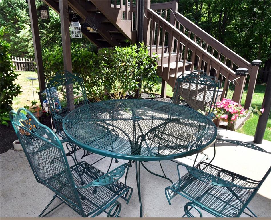 795 Sunset Ridge Lane Southeast Lawrenceville, GA 30045 - Photo 50 of 57 a view of a chairs and table in patio
