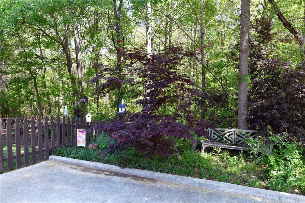 795 Sunset Ridge Lane Southeast Lawrenceville, GA 30045 - Photo 53 of 57 a backyard of a house with a table and chairs