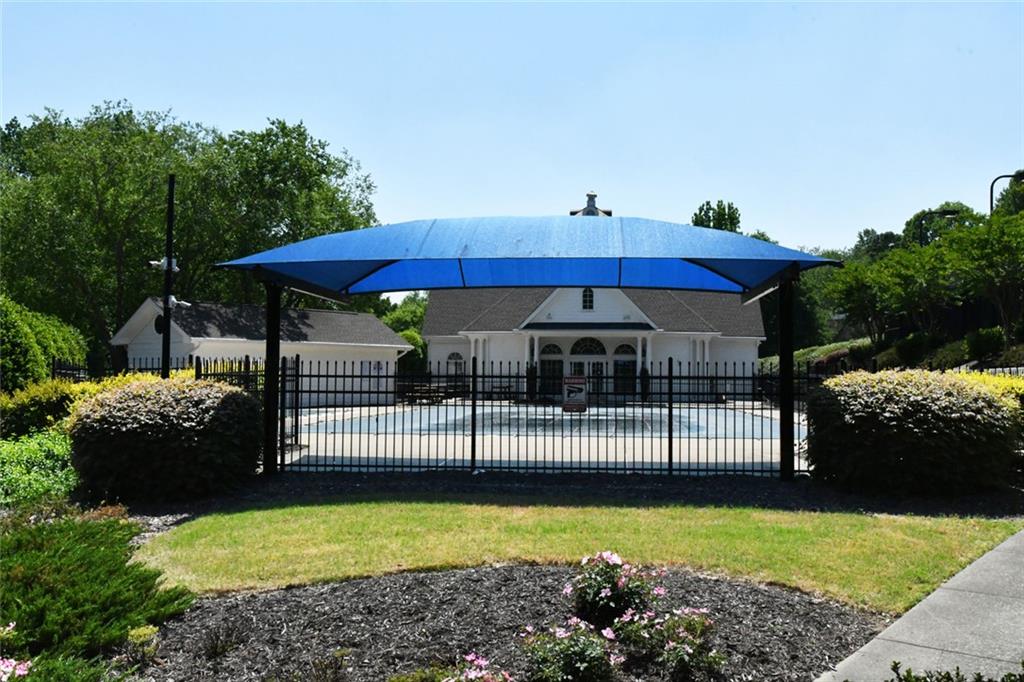 795 Sunset Ridge Lane Southeast Lawrenceville, GA 30045 - Photo 56 of 57 a view of a swimming pool with a patio