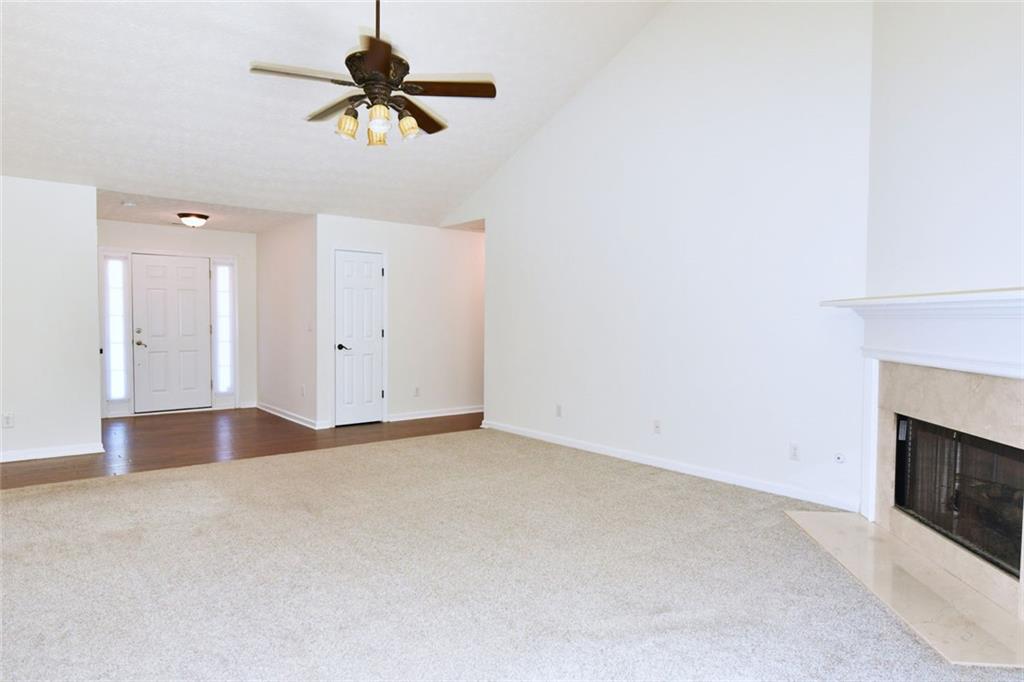 795 Sunset Ridge Lane Southeast Lawrenceville, GA 30045 - Photo 6 of 57 a view of empty room with ceiling fan