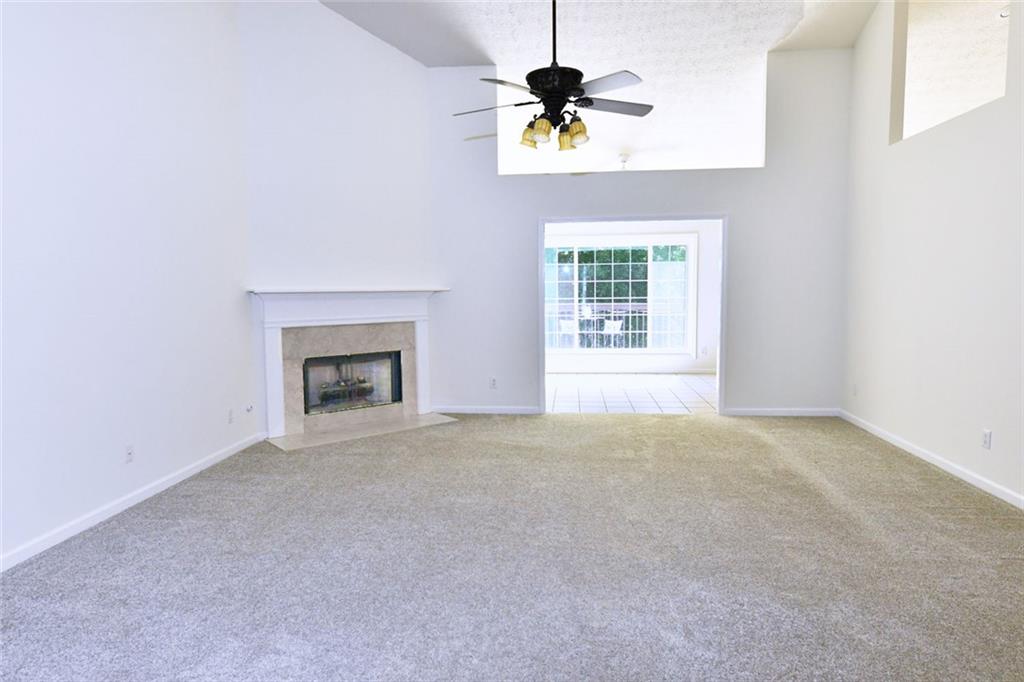 795 Sunset Ridge Lane Southeast Lawrenceville, GA 30045 - Photo 9 of 57 a view of an empty room with a window