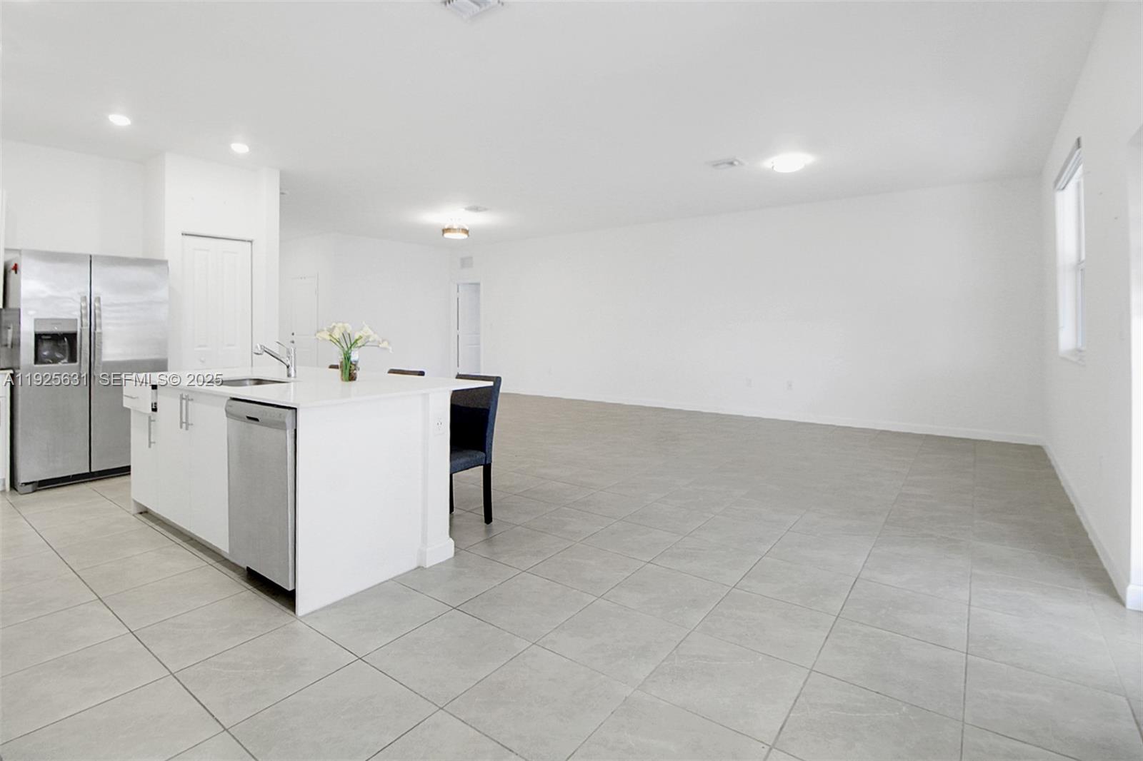 879 Southeast 26th Terrace Homestead, FL 33035 - Photo 17 of 43 a kitchen with stainless steel appliances cabinets and utility room