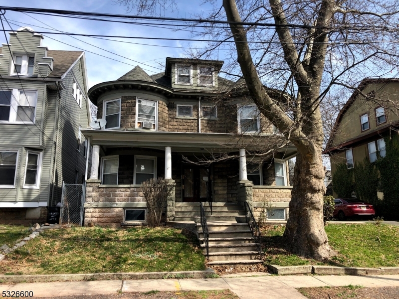 43 Mapes Avenue, Unit 2L Newark, NJ 07112 - Photo 1 of 7 a front view of a house with a yard
