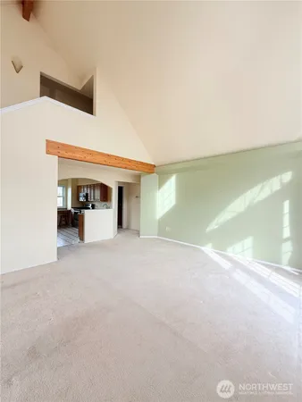 a view of a living room with a large window