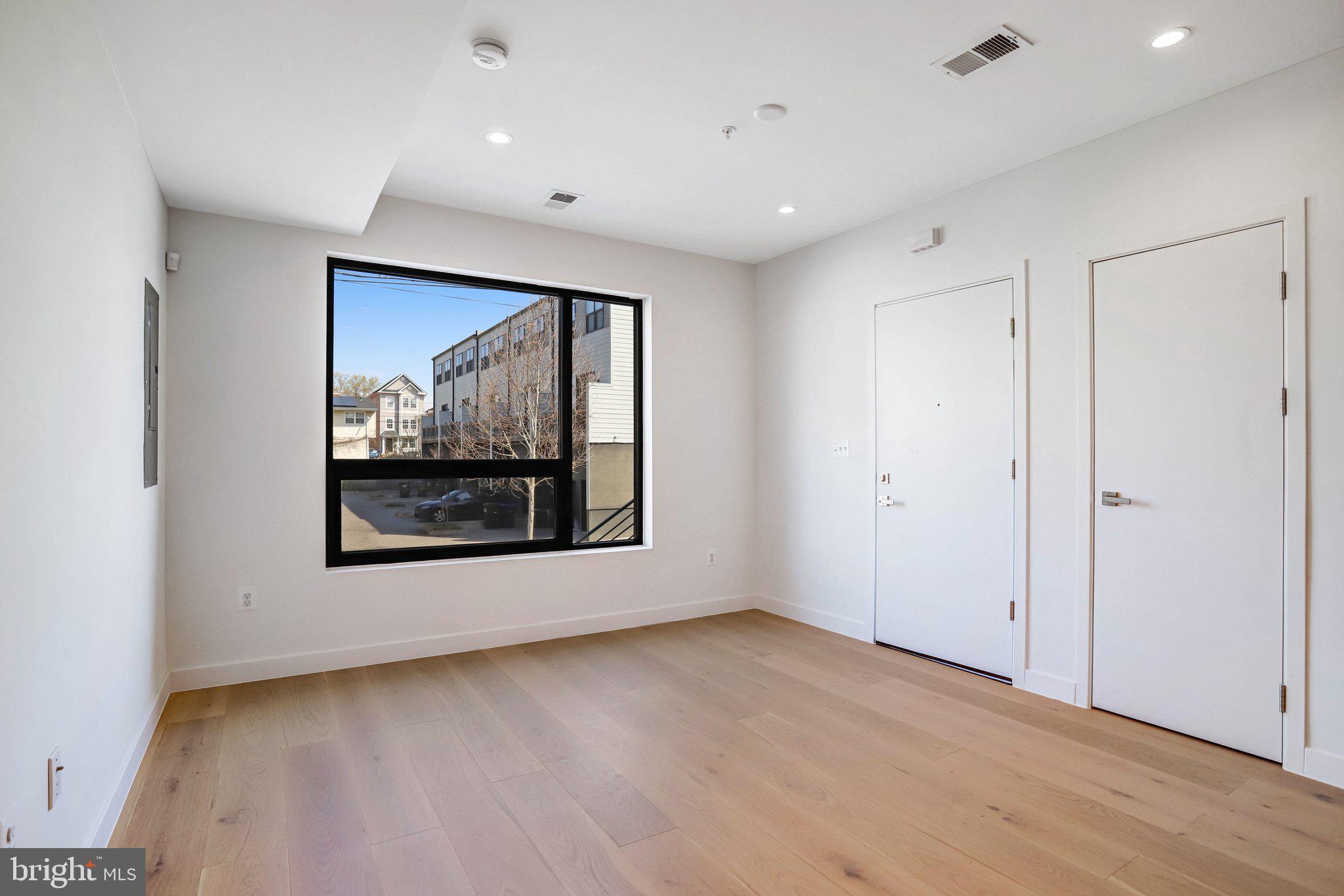 5221 F Street Southeast Washington, DC 20019 - Photo 11 of 63 a view of an empty room with a painting on the wall
